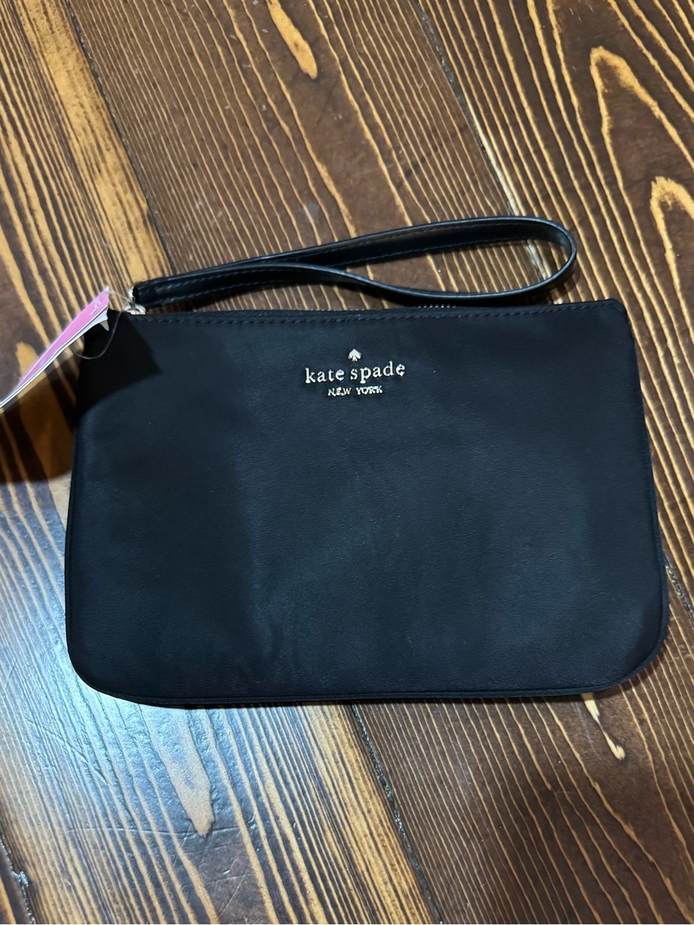 kate spade “Chelsea the Little” black wristlet clutch with gold logo